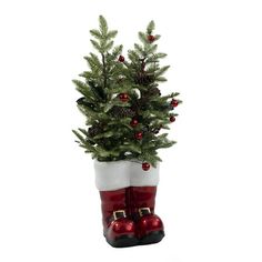 a small christmas tree in a red boot