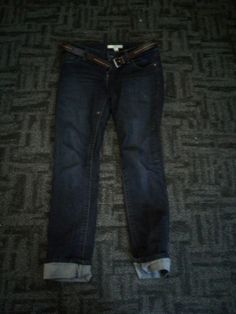 a pair of jeans laying on the floor