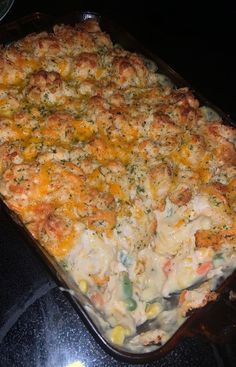 a casserole dish with chicken and vegetables in it