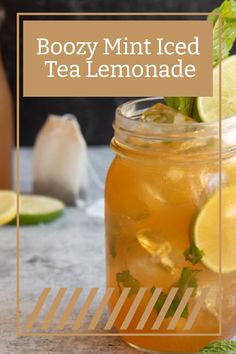 a mason jar filled with iced tea lemonade and garnished with mint leaves