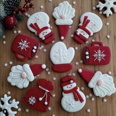 decorated cookies are arranged on a wooden table