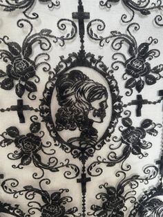 black and white lace with an image of a woman on it