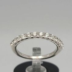 925 Silver Clear Cubic Zirconia Band Ring Size 5 Item w#2501 Clean and in good condition Marked 925 CZ Welcome to Westgate Jewels!! We specialize in vintage estate, designer, and fine jewelry. Our shop consists of items that are estate, antique, and / or vintage conditions unless otherwise noted. This means that most items are prior owned and may have some imperfections such as light scratches, scuffs, and / or patina. Our items are cleaned and polished professionally and inspected by our in-hou Dazzling Sterling Silver Stackable Rings With Diamond Accents, Formal Diamond Ring With Vs Clarity And Round Stone, Formal Diamond Ring With Vs Clarity, Dazzling Half Eternity Round Diamond Ring, Dazzling Half Eternity Diamond Ring, Formal Round Diamond Ring With Vs Clarity, White Gold Diamond Ring With Vs Clarity, Classic Crystal Ring With Diamond Accents For Anniversary, Formal Cubic Zirconia Ring With Prong Setting