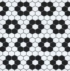 a black and white tiled floor with hexagonal tiles