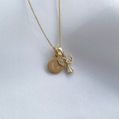 This stunning angel necklace will be her guardian and watch over her as she grows.  Our yellow gold vermeil & CZ Angel necklace makes the perfect gift for special occasions such as Christenings, Naming Ceremonies or a First Holy Communion. This beautiful angel charm measures 1x1cm, moving freely on a dainty 16″ belcher chain with a lobster clasp fastening at the back. Our yellow gold vermeil mini disc charm measures 8x8mm, perfectly sized for initials.  Our yellow gold vermeil jewellery is made Angelic Gold Pendant Necklace, Angelic Gold Necklaces As Gifts, Angelic Gold Necklaces For Gifts, Angelic Gold Necklace For Gift, Angelic Gold Pendant Jewelry, Silver Quotes, Angel Necklace, Gold Vermeil Jewelry, Gold Initial