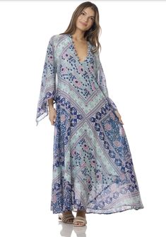 Indulge in the ethereal beauty of our Audrey Maxi Dress with Butterfly Sleeves in Blue. This stunning piece is crafted from 100% Indian cotton, making it soft and comfortable against your skin. The intricate butterfly sleeves add a touch of whimsy and romance, making you feel like a true goddess. The dress features a beautiful blue print that will transport you to a dreamy paradise. The flowy maxi length adds a touch of elegance and grace to your every step. Whether you're strolling along the be Blue V-neck Festival Cover-up, Blue Breezy Flowy Cover-up, Blue Flowy Breezy Cover-up, Spring Flowy Dresses With Kimono Sleeves, Spring Bohemian Dresses With Butterfly Sleeves, Spring Dresses With Flowy Fit And Kimono Sleeves, Spring Dresses With Flowy Kimono Sleeves, Bohemian Spring Dress With Butterfly Sleeves, Flowy Spring Dresses With Kimono Sleeves