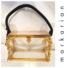 Outrageously Fabulous & Totally Over The Top Markarian Evening Bag!! Fabulous Hard Box Shaped Clear Lucite With An Etruscan Revival Gold-Tone Frame And A Simple Black Detachable Carry Handle. The Corners Have These Magnificent, Highly Detailed Etruscan Women That Are Absolutely Magnificent! Front Hidden Clasp Closure. No Optional Interior Pouches Provided. Signed On Front. Brand New With Tags Absolutely Authentic Box Bag, Over The Top, Evening Bags, Gold Tones, Bag Lady, Pouch, Tags, Frame, Gold