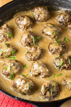 meatballs and gravy are in a skillet