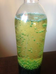 a bottle filled with liquid sitting on top of a table