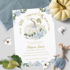 a white pumpkin themed baby shower with blue flowers