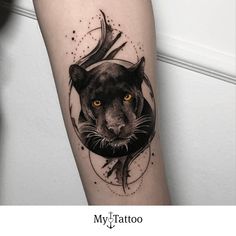 a black and white tiger tattoo on the right forearm, with an orange eye in the center