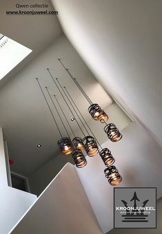 several lights hanging from the ceiling in a room