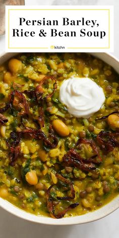 persian barley, rice and bean soup in a white bowl with sour cream on top