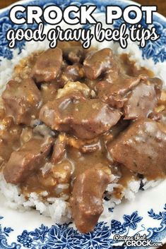 a close up of a plate of food with rice and gravy on it