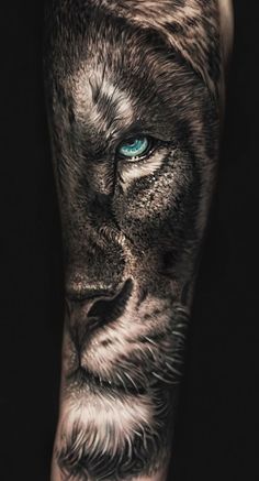 a black and white tattoo with blue eyes