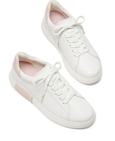 Kate Spade New York's Lift sneakers update trend-right white sneaker style with a pop of color in a contrast collar on a timeless low-top profile. Spring High-top Sneakers With Contrasting Heel Counter, Sporty Slip-on Sneakers With Contrasting Heel Counter, Sporty Slip-on Sneakers With Contrasting Heel, White Platform Sneakers With Contrast Sole For Spring, White Slip-on Sneakers With Textured Sole, Modern White Slip-on Sneakers With Perforated Toe Box, Modern White Platform Sneakers With Contrasting Heel, White Low-top Slip-on Sneakers With Gum Sole, Slip-on Low-top Sneakers With Gum Sole