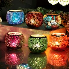 colorful candles are lined up on a table