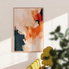 a painting hanging on the wall next to a teddy bear in a room with white walls