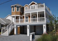 two story house with balconies on the second floor