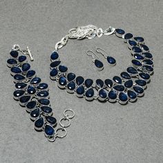 Faceted Iolite Jewelry Set 925 Sterling Silver Necklace Set Pear Shape Gemstone Jewelry Handmade Adjustable Chain Necklace For Birthday Gift SKU:- G158 Metal:- Sterling Silver Metal Purity:- 925 Gemstone:- Iolite  Gemstone Color:- Blue Gemstone Shape :- Pear Stone Setting :- Channel Necklace Length:- 18 Inches With Adjustable Chain Bracelet Length:- 9 Inches With Adjustable Chain Earrings Length:- 1.3 Inches Note We are continuously adding new products in our store. So keep coming back to see mo Sterling Silver Natural Stones Jewelry For Party, Faceted Teardrop Sapphire Jewelry, Teardrop Sapphire Faceted Jewelry, Silver Sapphire Jewelry With Natural Stones, Faceted Sapphire Silver Jewelry, Faceted Sterling Silver Jewelry For Party, Faceted Sterling Silver Party Jewelry, Channel Necklace, Iolite Jewelry