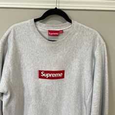 Original Supreme Brand Gray Color Long Sleeve 100% Cotton T Shirt Brand New Wear Only One Time Logo Crew Neck Top For Fall, Streetwear Crew Neck Tops With Embroidered Logo, Classic Logo Tops For Fall, Basic Crew Neck Tops With Embroidered Logo, Logo Crew Neck Top With Relaxed Fit, Classic Crew Neck Top With Logo Print, Relaxed Fit Logo Top With Crew Neck, Crew Neck Top With Embroidered Logo In Relaxed Fit, Relaxed Fit Crew Neck Top With Logo