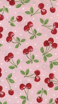 a pink fabric with cherries on it