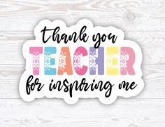 a sticker that says thank you teacher for insuring me on a wooden background