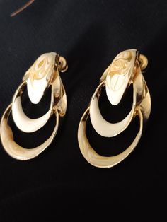 Very unique detail on these earrings - Swirls of Creamy Gold and Tan. Great for wedding dressy work. These earrings are post earrings. Excellent condition. Formal White Pierced Chandelier Earrings, White Pierced Chandelier Earrings For Formal Occasions, Formal White Drop Earrings, Cream Color, Post Earrings, Dangle Drop Earrings, Drop Earrings, Cream, Gold