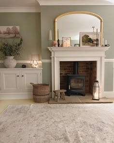 a living room with a fire place and rug