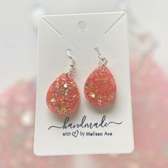 Each earring is handcrafted with care.  * Handcrafted with high-quality resin for durability and beauty. * Lightweight design for comfortable all-day wear. * Hypoallergenic for sensitive ears. * Each earring is unique and may be slightly different from what is pictured. No two earrings are completely alike. Material: * UV resin * Glitter * Hypoallergenic and nickel free Stainless Steel hardware Care: *To clean your earrings, use a damp cloth and wipe gently. *Remove the earrings before showering or swimming. *Avoid using chemicals, perfume, jewelry cleaners, or any aerosol products. Do not hesitate to send me a message if you have any questions. Please check my other listings at https://designsbymelissaa.etsy.com. Perfume Jewelry, Resin Glitter, Earrings Teardrop, Earrings Resin, Glitter Earrings, Jewelry Cleaner, Uv Resin, Sensitive Ears, Teardrop Earrings