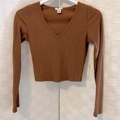 Questions? Leave A Comment Below!Cropped Top. Lightweight Poly/Cotton/Spandex. Perfect With Jeans. Never Used. Brown Stretch Long Sleeve Top For Spring, Fitted Cropped Long Sleeve Casual Top, Fitted Casual Cropped Long Sleeve Top, Spring Stretch Brown Long Sleeve Top, Fitted Ribbed Long Sleeve Crop Top, Fitted Brown V-neck Crop Top, Brown Stretch Long Sleeve Crop Top, Fitted Brown Long Sleeve Top Casual, Casual Fitted Brown Long Sleeve Top