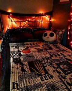 a bed with lights on the headboard and a soccer ball sitting on top of it