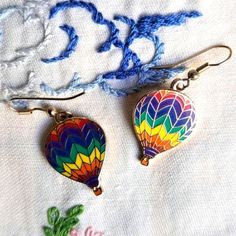 Excellent condition vintage metal hot air balloon gold tone earrings in rainbow cloisonné. See pics for best description.  These will hang about 1.5" Smoke-free. Same or next business day shipping. A note about shipping: I endeavor to reuse shipping materials. Every item will be packed securely and with care. I am a caregiver and sell items online for a small income. Your purchase helps me to continue in my role, supporting my autistic son with chronic pain. Thank you. Rainbow Hot Air Balloon, Earrings In Gold, Colorful Rainbow, Caregiver, Hot Air Balloon, Sell Items, Chronic Pain, Air Balloon, Gold Tone Metal