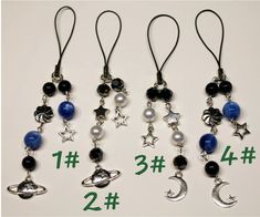 three different necklaces with stars, planets and moon charms hanging from each one's ear