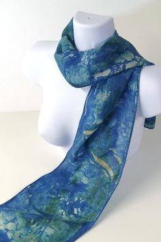 This particular scarf features a medley of blues with traces of off-white and tan brown - it was hand-dyed using non-toxic dyes, and the hem is hand-finished.  Constructed from a silk/wool 65%/35% blend, it is lightweight and semi-sheer with a diagonal weave. Blends such as this are warmer for winter than 100% silk, while the looser weave is softer with a slight raspy feel, closer to a heavyweight chiffon. It makes a great fabric base for hand-painted and dyed techniques. The hand-dyed/painted d Artistic Hand Dyed Blue Silk Scarf, Blue Bohemian Hand-dyed Silk Scarf, Blue Bohemian Hand Dyed Silk Scarf, Blue Hand-dyed Silk Scarf For Summer, Blue Hand Dyed Silk Scarf For Summer, Hand Dyed Blue Silk Scarf For Summer, Blue Hand Painted Bohemian Silk Scarf, Artsy Blue Scarf As A Gift, Bohemian Blue Hand Painted Silk Scarf