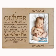 a wooden frame with a baby's birth photo on the front and bottom side