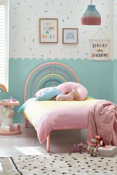 a child's bedroom decorated in pastel colors and sprinkles