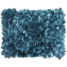 a pillow made out of blue flowers on a white background