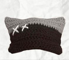 a crocheted pillow with an airplane on it