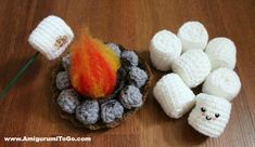 there are marshmallows and a fire on the table