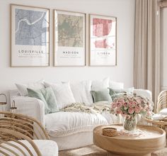 a living room with wicker furniture and pictures on the wall above it's couch