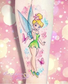 a woman's leg with a cartoon tinkerbell tattoo on it