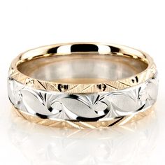 two tone gold and silver wedding ring with leaves on the inside, set against a white background