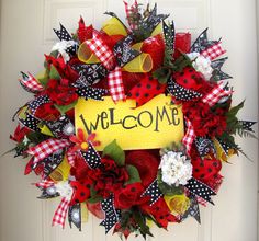 a welcome wreath with ladybugs and flowers