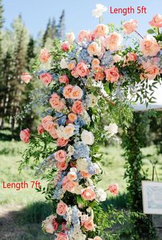 a cross made out of flowers and greenery