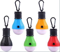 four different colored light bulbs with black handles