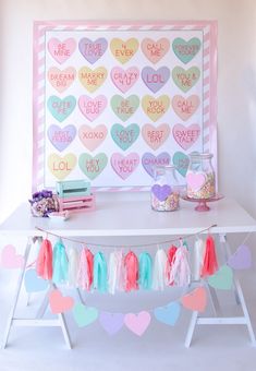 a white table topped with lots of hearts