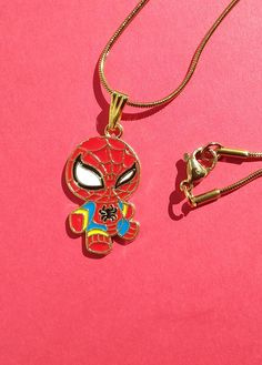 Red Spider Cartoon Man Charm Necklace Gift for Boy or Man Limited Supply! * Charm is strung on    A 45cm  long 1mm wide SNAKE chain    with lobster clasp. FOR OTHER CHAIN OPTIONS WITH THIS CHARM GO HERE: https://www.etsy.com/listing/1725919391/cartoon-spiderred-man-charm-necklace * Eco-packaged in a festive spiderweb    reusable gift bag * Ships same day as ordered from Maine   to USA destinations only. BELIEVE in CARTOON SUPERHEROS! Spiderman Necklace, Spiderman Pendant, Novelty Red Jewelry With Charms, Red Novelty Jewelry With Charms, Spider Cartoon, Cartoon Jewelry, Novelty Red Charms Jewelry, Gift Cartoon, Red Spider