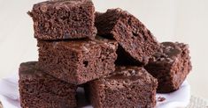 a white plate topped with brownies on top of a table