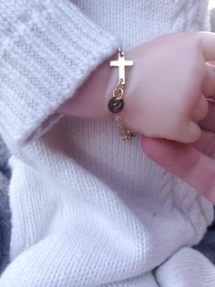 "Gold Cross Baby Bracelet/Baptism Bracelet Baby/Goddaughter Gift/Gift from Godmother Precious and Dainty!! This bracelet is made from 14 K Gold Filled chain. This chain is a sturdy 2x2.5mm. This more robust gauge helps prevent breaking from yanks or tugs from little hands! The Cross is also 14 K Gold Filled as well as the rings connecting the cross to the chain and the disc. The tiny disc, also 14 K Gold Filled, comes stamped with the initial of your choosing. Bracelet also comes with 1 inch ext Adjustable Gold Rosary Bracelet For Birthday, Adjustable Gold Rosary Bracelet For Baptism, Gold Cross Bracelet For Baptism, Personalized Gold Rosary Bracelet For Baptism, Personalized Gold Rosary Bracelet For Birthday, Personalized Cross Rosary Bracelet For Baptism, Personalized Gold Rosary Bracelet For First Communion, Personalized Gold Name Bracelet For Baptism, Baptism Bracelet